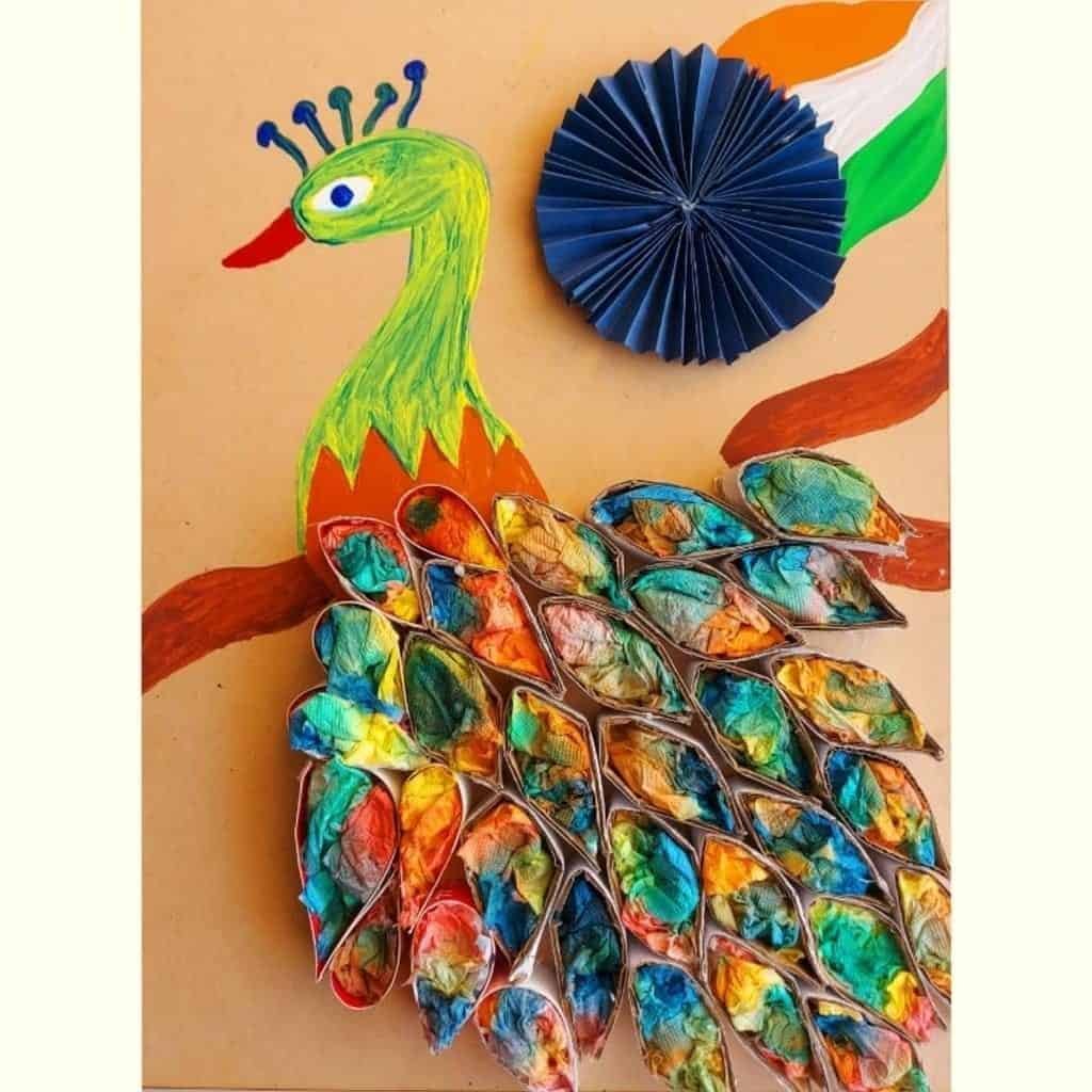 Decorating peacock feathers with painting on tissue paper